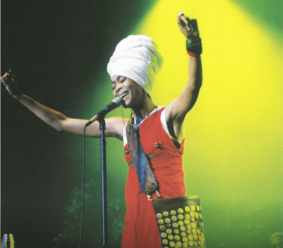 Erykah Badu performing on stage